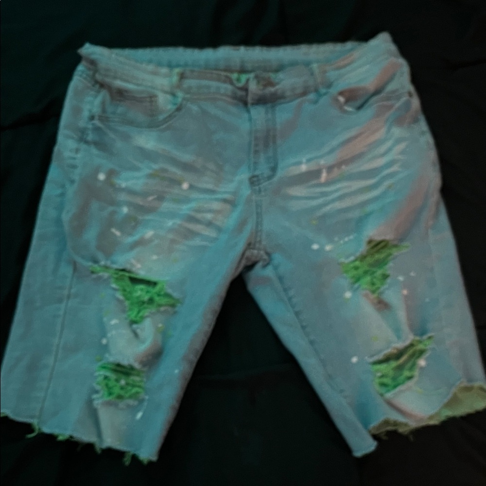 Distressed Denim Shorts with Green Accents